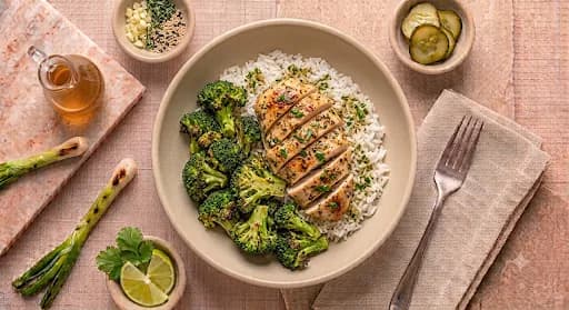 Garlic Herb Chicken Plate — Jasmine rice, roasted broccoli, lemon herb sauce.