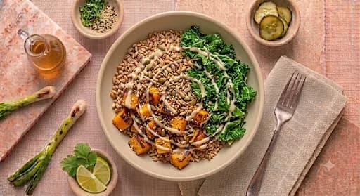 Harvest Grain Bowl — Farro, roasted squash, kale, toasted seeds, tahini.