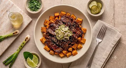 Korean Beef & Sweet Potato — Gochujang beef, roasted sweet potato, sesame, pickled cucumber.