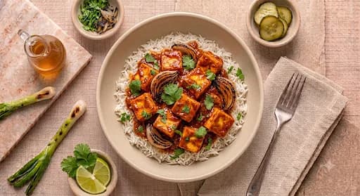 Paneer Tikka Masala & Basmati — Paneer tikka masala, basmati, charred onion, cilantro.
